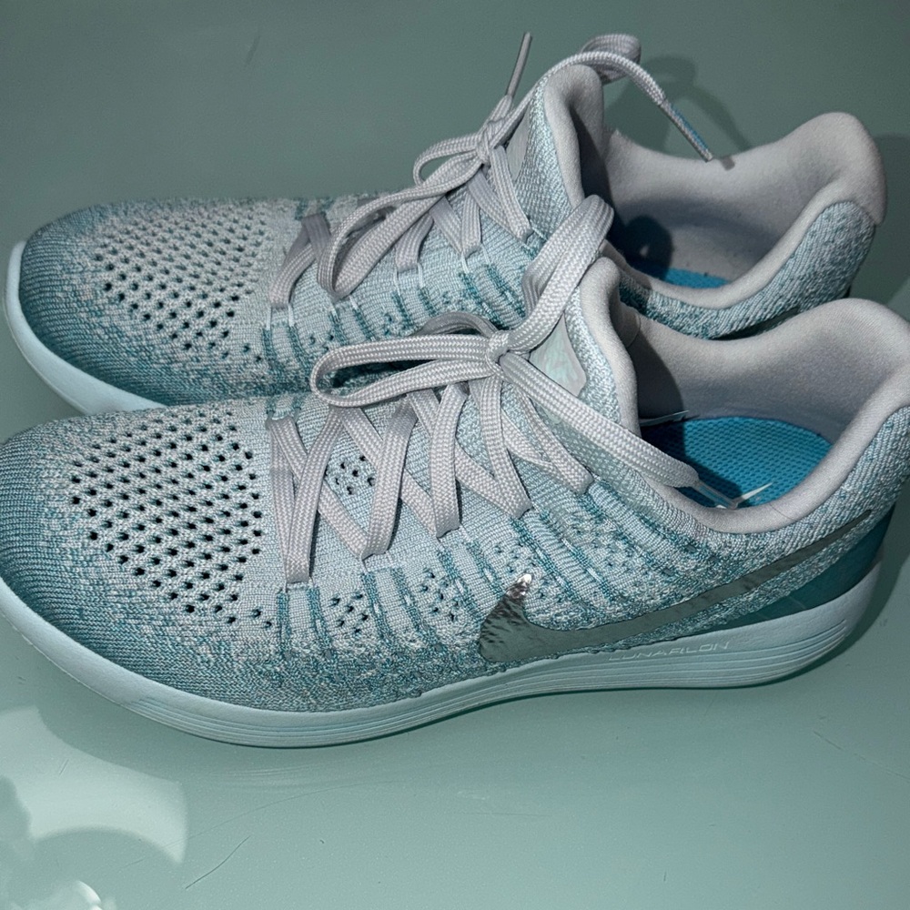 Nike Women’s Light Teal Flyknit Athletic Sneakers